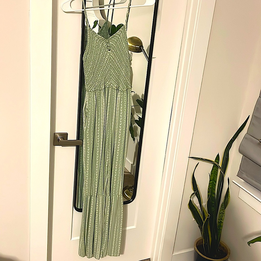 Green full length patterned spaghetti strap romper with pockets. M